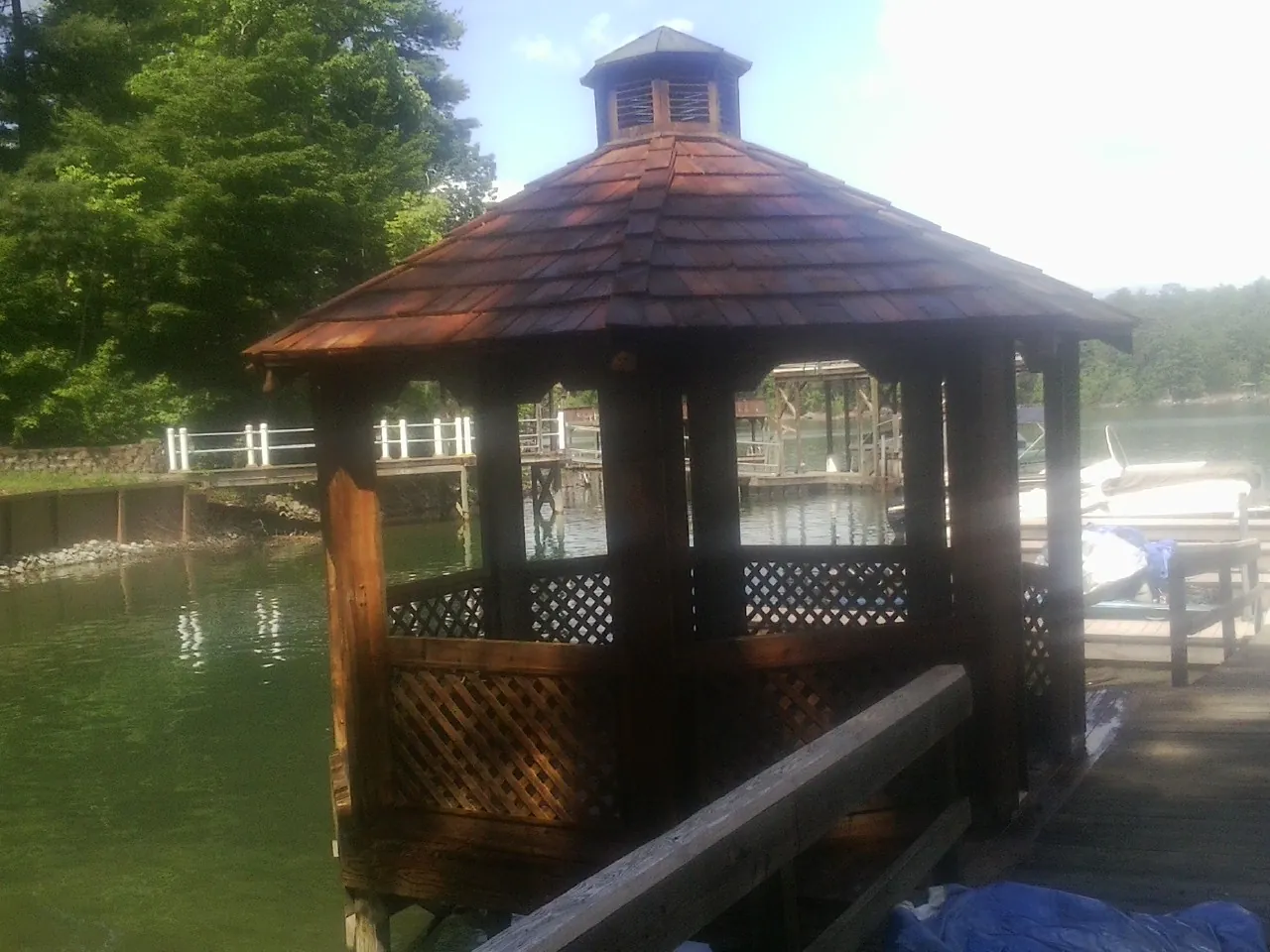 Cedar shake gazebo roof rebuilt on a lake dock in Chatham